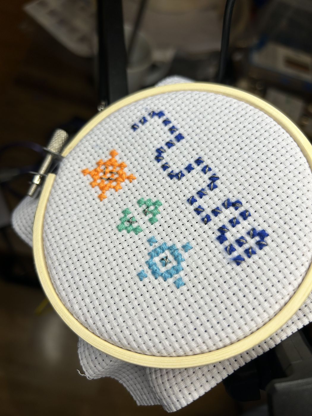 Finished cross-stitch pattern with embedded LEDs
