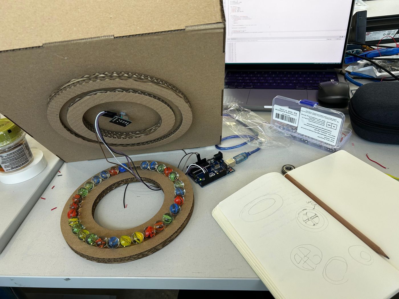 Laser-cut cardboard rings and bearings on the desk